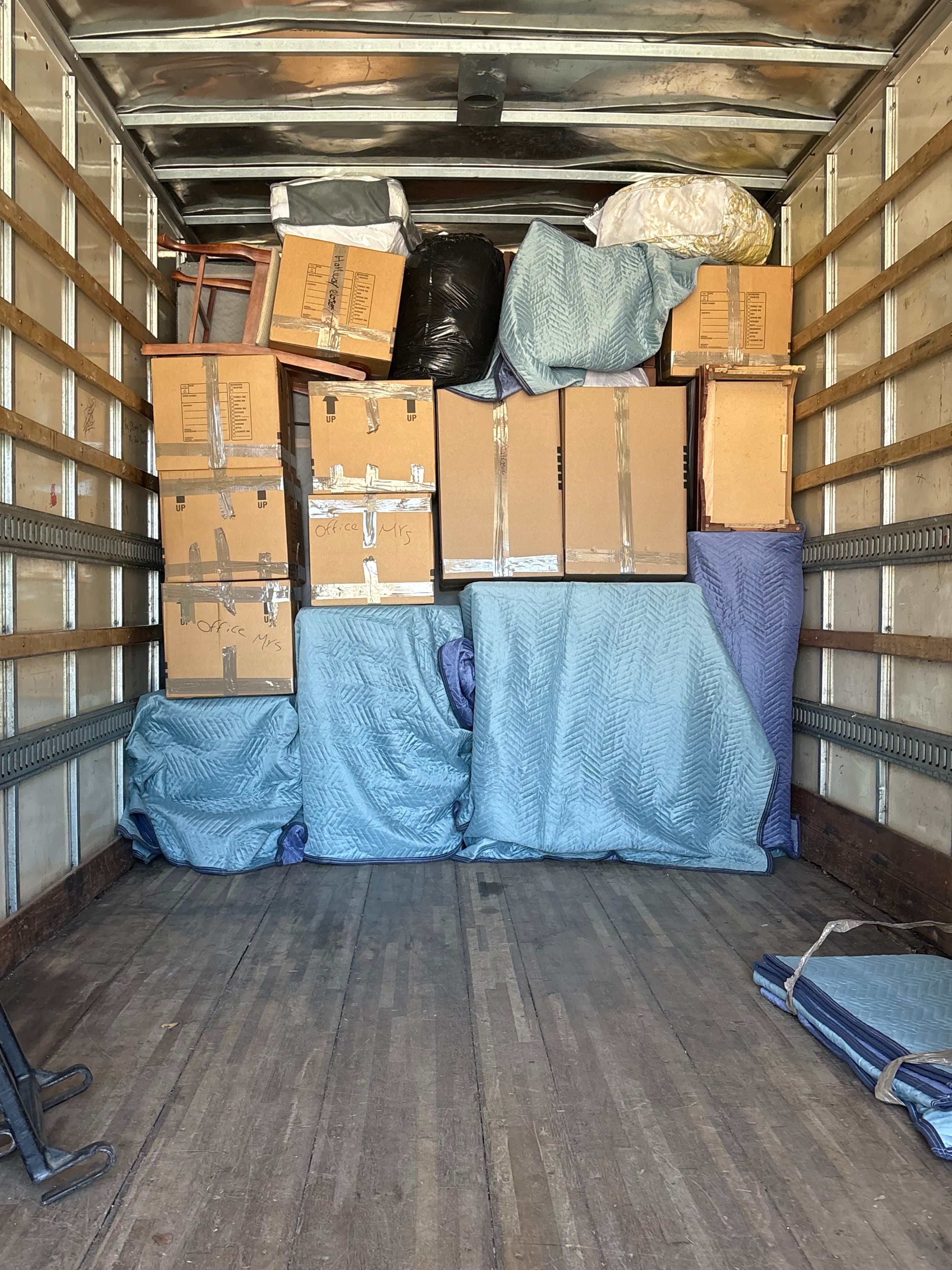 Vantage moving team with a loaded interstate moving truck